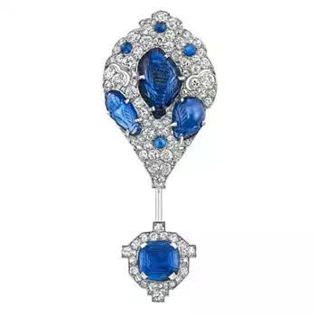 Cartier platinum, carved sapphire, diamond jabot, 1925