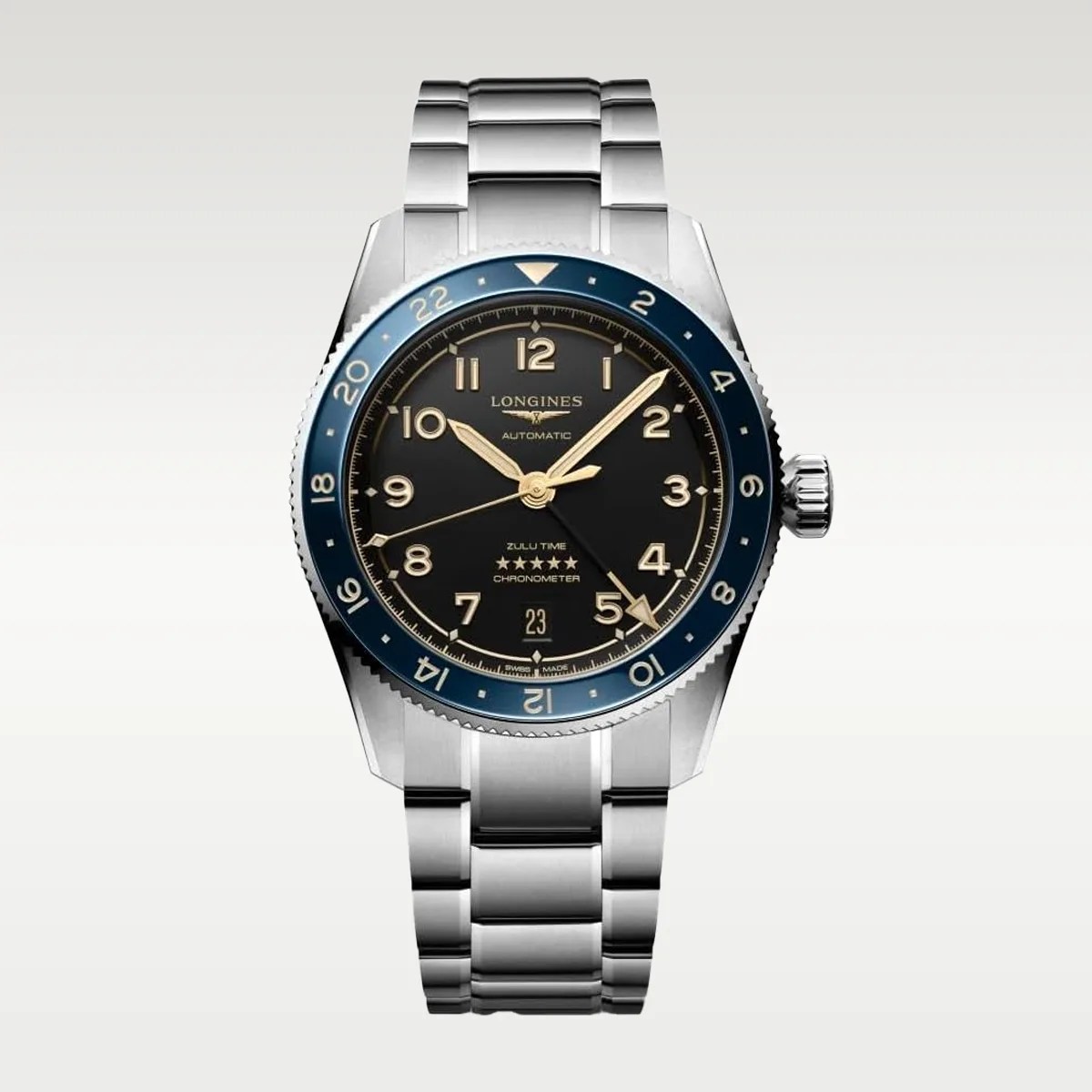 Silver metal bracelet watch with black dial, gold-tone hands and numerals, blue bezel, and date display at 6 o'clock.