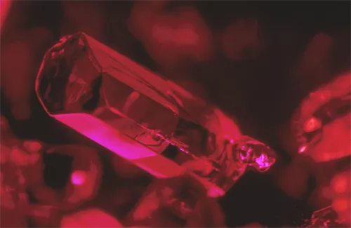 Ruby is defined as crystalline aluminium oxide, called corundum, with traces of the chemical element chromium, which is responsible for its red colour.