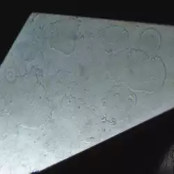 3. Burned surface spots (burn marks) on a star facet of a brilliant-cut diamond. (10x magnification).