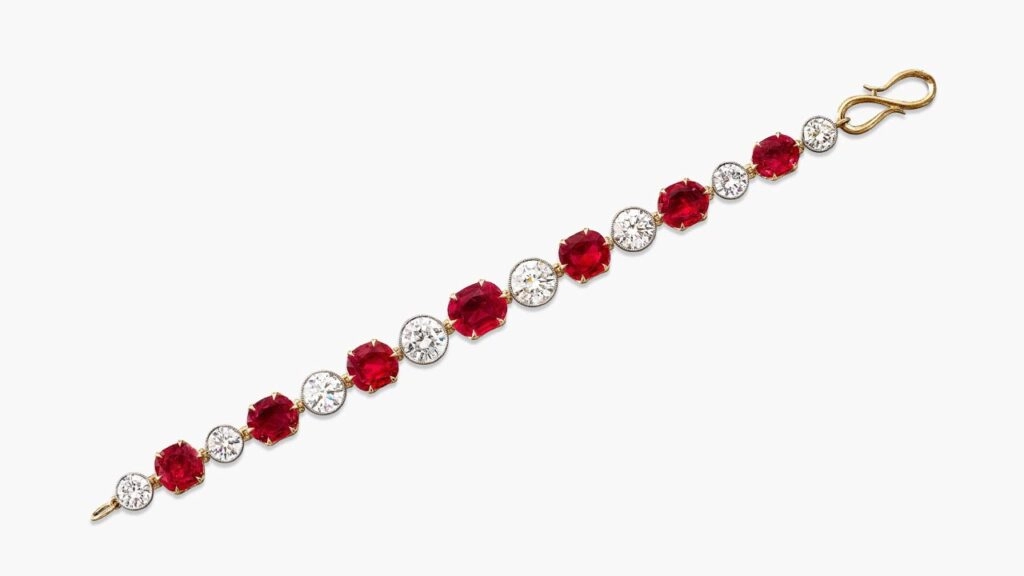 A bracelet featuring a line of seven graduating oval and cushion-shaped Burmese pigeon’s blood rubies weighing 3.73, 3.25, 3.15, 3.15, 3, 2.84 and 2.56 carats, spaced by brilliant-cut diamonds Sotheby's image