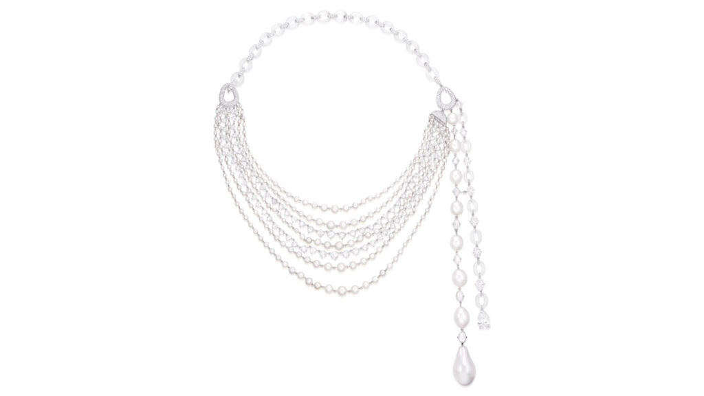 A House of Glenn Spiro necklace features a line of eight graduated natural pearls, highlighted by a pear-shaped 3.02-carat diamond, and decorated with natural pearls, seed pearls, oval, rose- and brilliant-cut diamonds, and icy jadeite hoops at Phillip image
