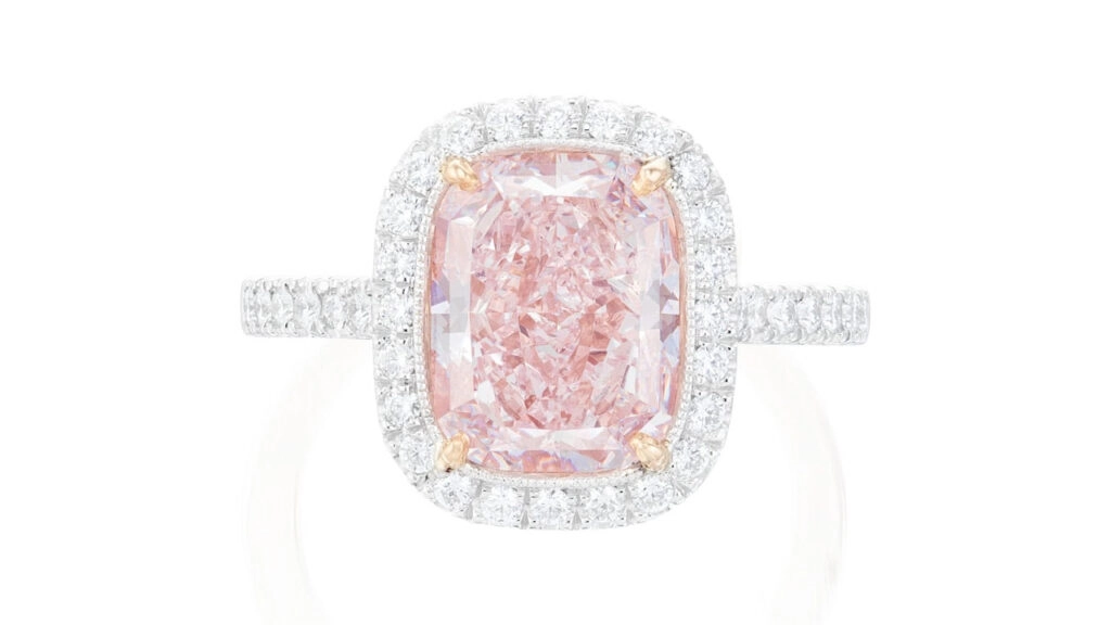 This ring centers a round-cornered rectangular modified brilliant-cut, 4.05-carat, fancy-light-pink diamond in a brilliant-cut diamond surround at Phillips image
