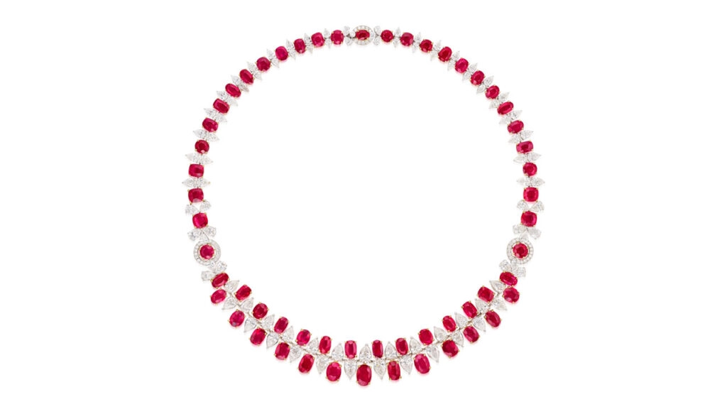 This necklace bears 56.98 carats of oval and cushion-shaped Burmese rubies, spaced by pear-shaped diamonds at Phillips image