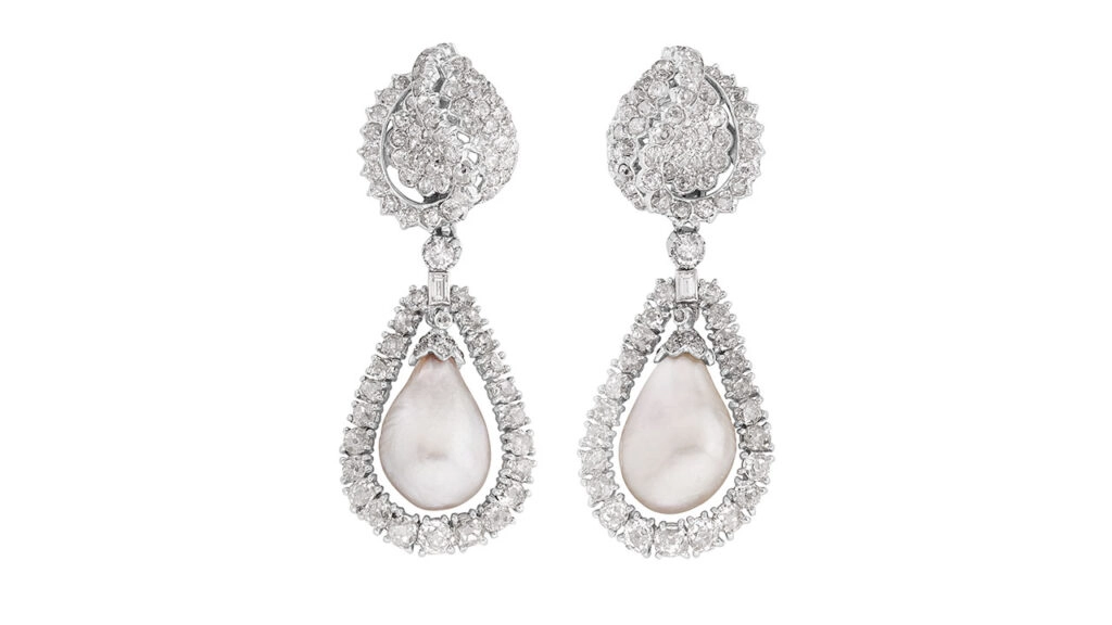A pair of Monture Cartier earrings, each centering a natural pearl in a diamond surround at Phillips image