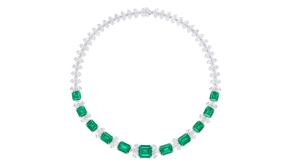 This necklace comprises 11 graduated step-cut Colombian emeralds with a total weight of 45.94 carats, spaced by pear-shaped diamonds at Phillips image