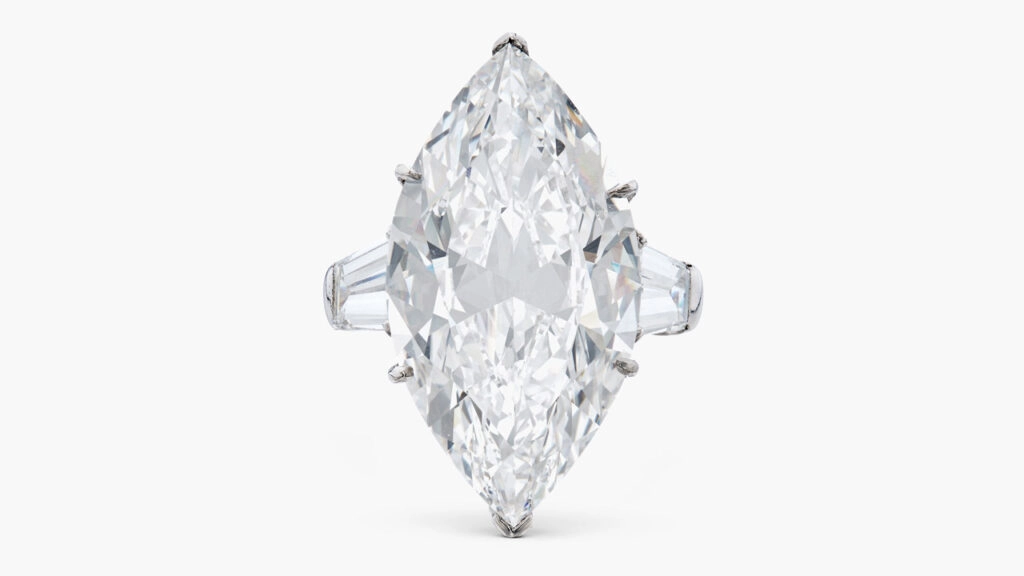 A Harry Winston piece, this one a ring with a marquise-shaped, 13.76-carat, D, internally flawless diamond center stone between two tapered baguette diamonds at Sotheby's image