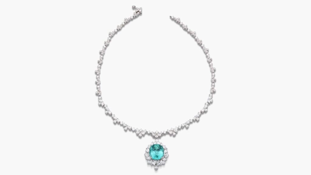 A necklace sporting a detachable pendant with a cushion-shaped, 19.27-carat Nigerian Paraíba tourmaline, framed with pear-, marquise-shaped and brilliant-cut diamonds, and including similarly shaped diamonds along the necklace at Sotheby's image