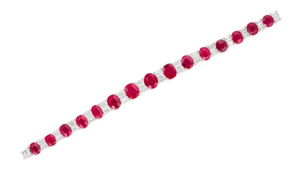 This bracelet features 15 graduated Burmese rubies totaling 30.21 carats, spaced by emerald-cut diamonds at Phillips image