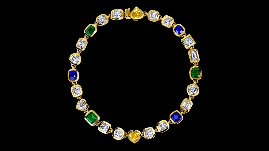 This necklace comprises 17 diamonds weighing around 5 carats each, with colors ranging from J to L and clarity from VS2 to SI1, as well as three Colombian emeralds totaling 16.48 carats and three Sri Lankan blue sapphires weighing a combined 21.48 carats at Joopiter image