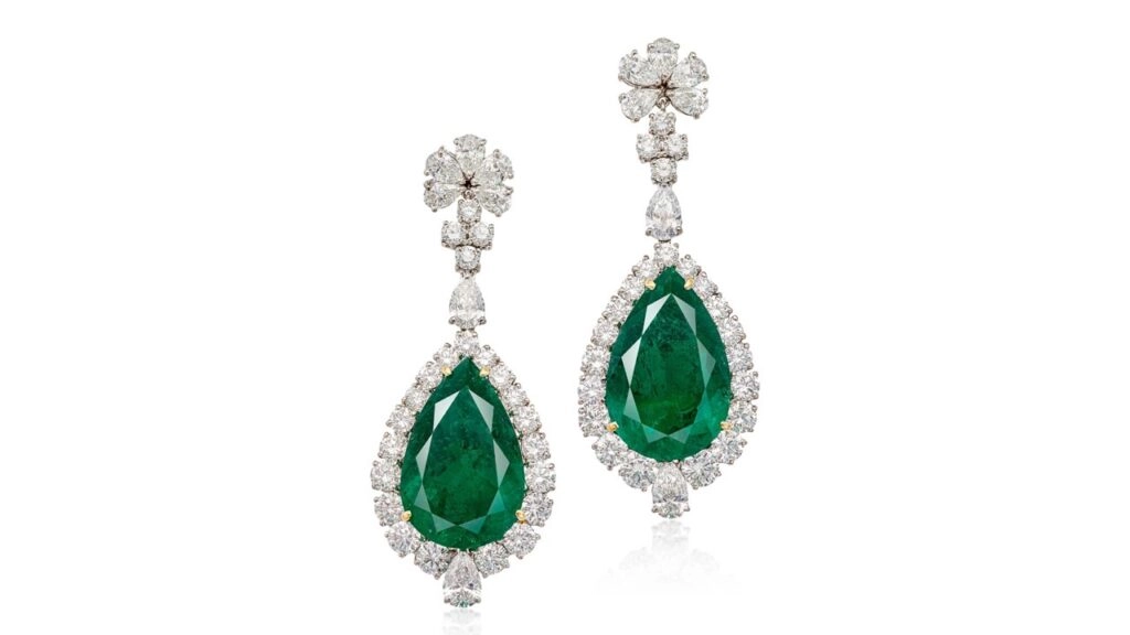 A pair of earrings bearing pear-shaped Colombian emeralds weighing 11.52 and 13.74 carats framed with and suspended from an estimated 10 carats of pear-shaped and brilliant-cut diamonds at Sotheby's image