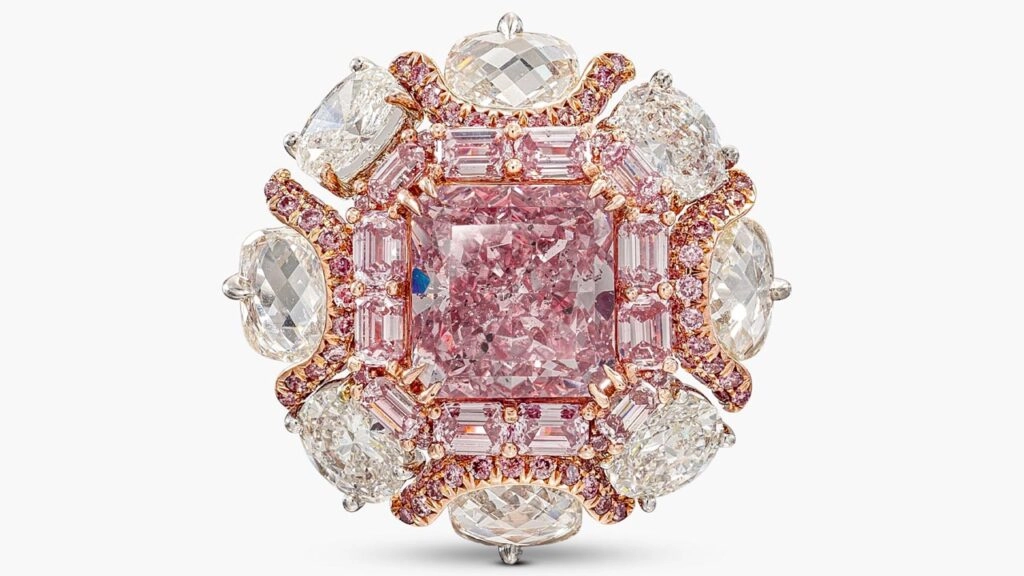 A ring, bearing a cut-cornered square modified brilliant-cut, 4.63-carat, fancy-intense-purplish-pink, I1 diamond within a surround of step-cut diamonds of pink tint at Sotheby's image
