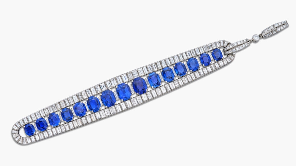 A Van Cleef & Arpels bracelet designed as a line of cushion and oval-shaped Kashmir and Burmese sapphires, with baguette, tapered baguette, square- and brilliant-cut diamonds at Sotheby's image