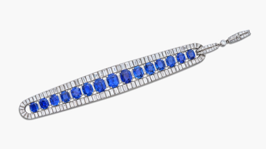 A Van Cleef & Arpels bracelet, designed as a line of cushion and oval-shaped Kashmir, Burmese and Ceylon sapphires, spaced and bordered by baguette and tapered baguette diamonds at Sotheby's image